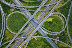 Aerial view of highway junctions. Bridge roads shape in structure. Top view. Urban city