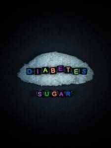 Black bead with color letter in word DIABETES LESS SUGAR with sugar and black background.Top view.