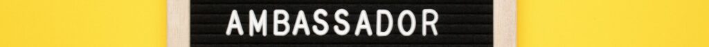 Brand Ambassador Text on letter board on yellow background