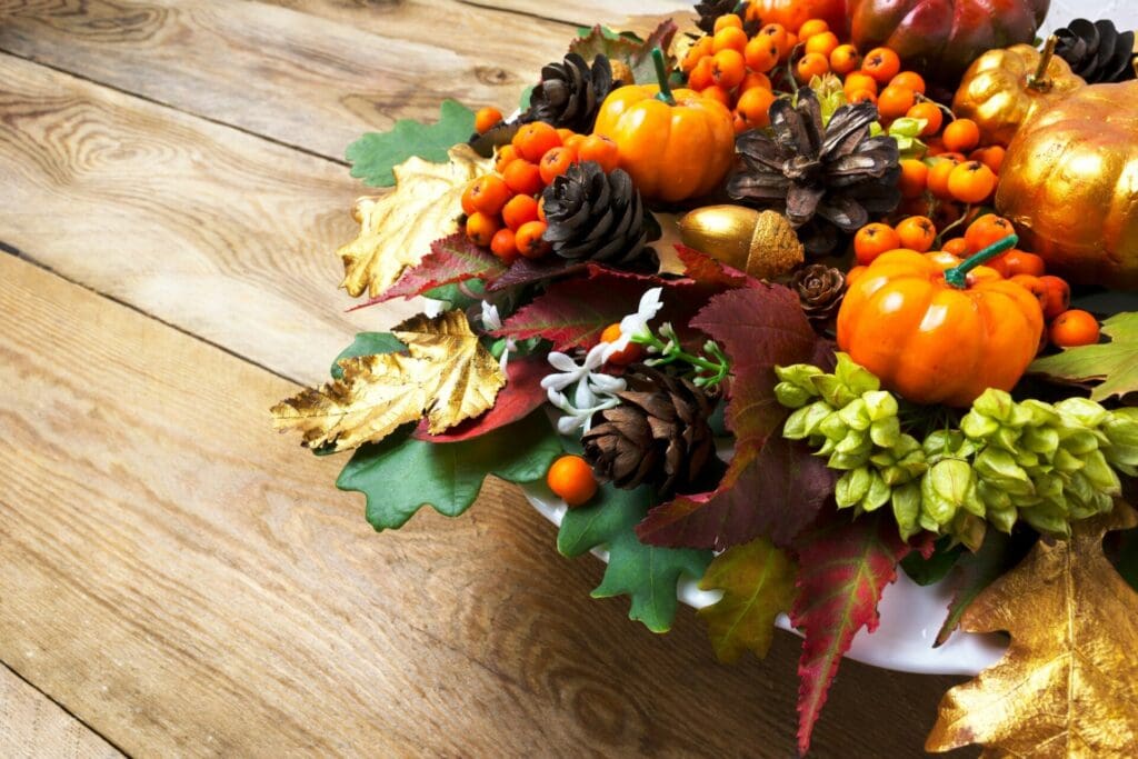 Fall or Thanksgiving holiday arrangement with pumpkins and autum