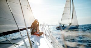 Young handsome man relaxing on his sailboat